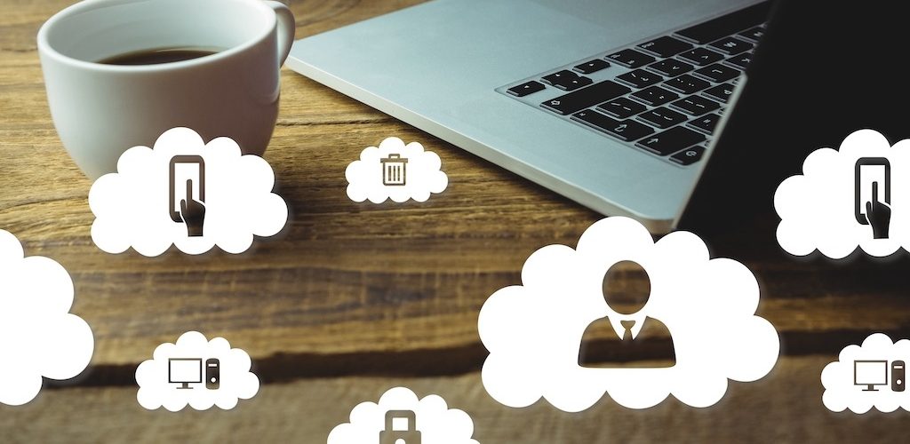 Composite image of laptop and coffee on a desk with cloud icons Cloud Computing Online Courses